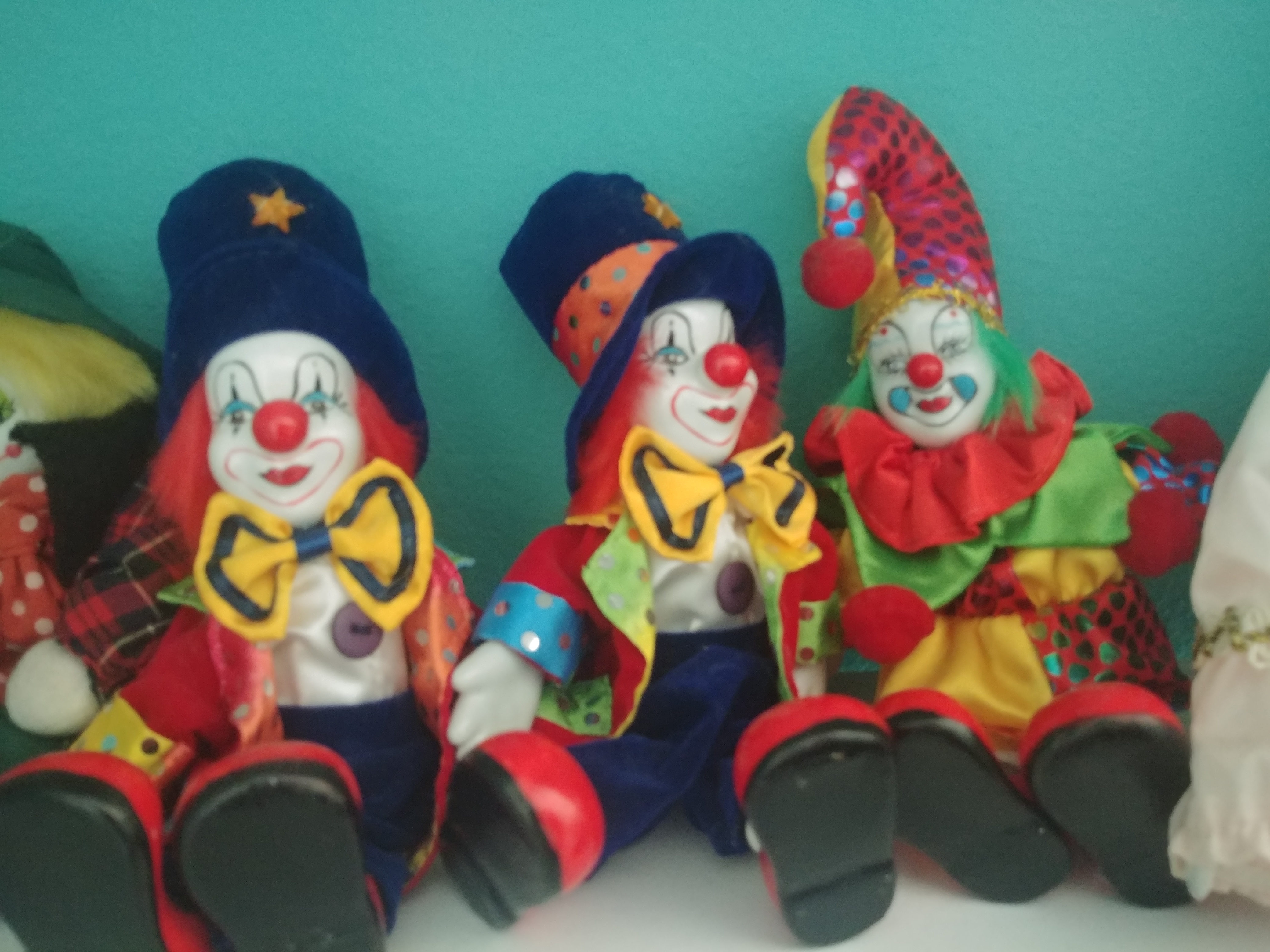 three clown dolls